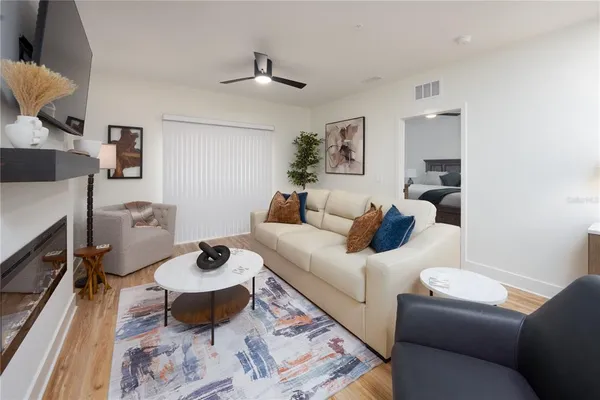 a living room with furniture and a fireplace