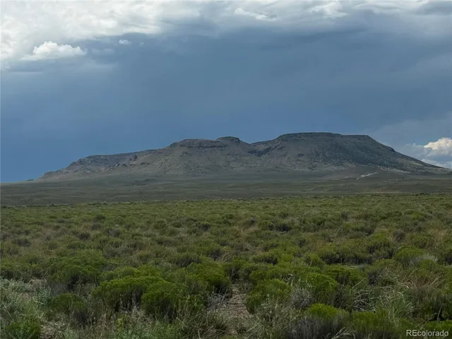 a view of mountains and valleys