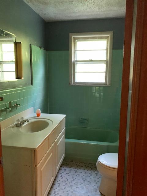 3137 South Main Street Tennessee Ridge, TN 37178 - Photo 11 of 13 a bathroom with a sink and a toilet