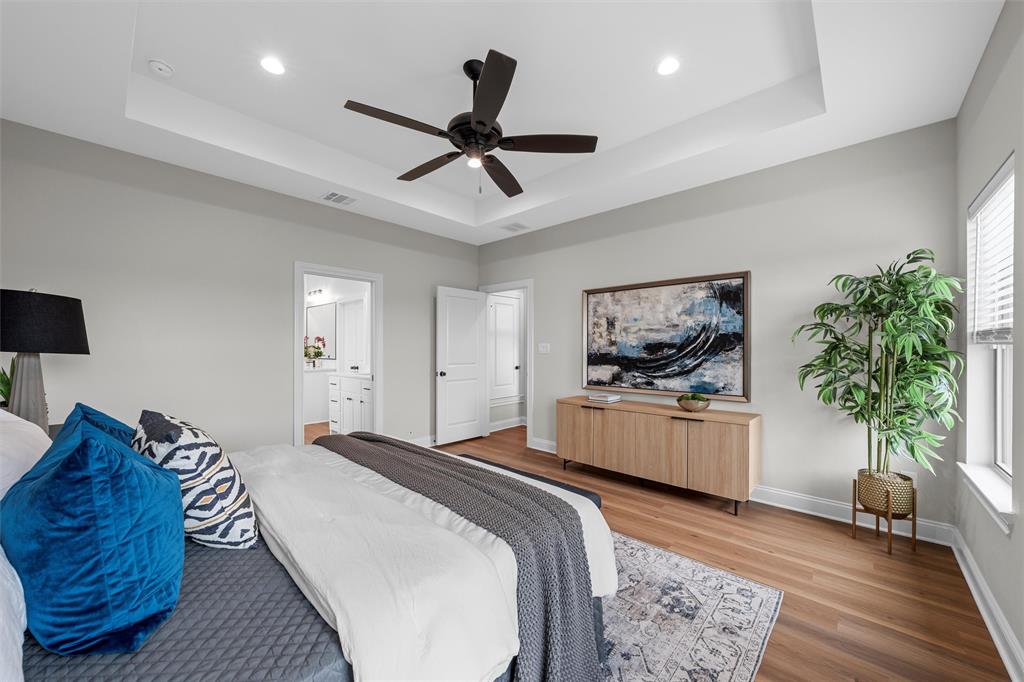 1320 Promised Land Road Hewitt, TX 76643 - Photo 18 of 26 a bedroom with a bed and a potted plant