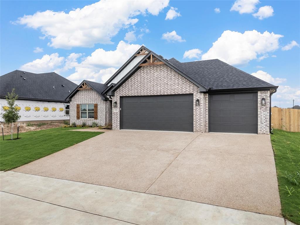 1320 Promised Land Road Hewitt, TX 76643 - Photo 2 of 26 a front view of house with yard and garage
