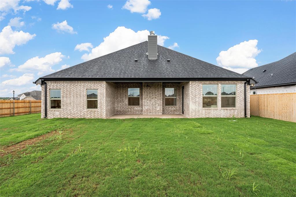 1320 Promised Land Road Hewitt, TX 76643 - Photo 23 of 26 a front view of a house with a garden