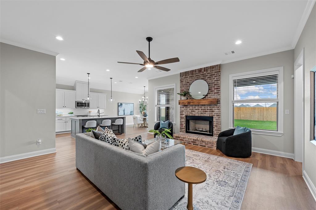 1320 Promised Land Road Hewitt, TX 76643 - Photo 3 of 26 a living room with furniture a fireplace and a window
