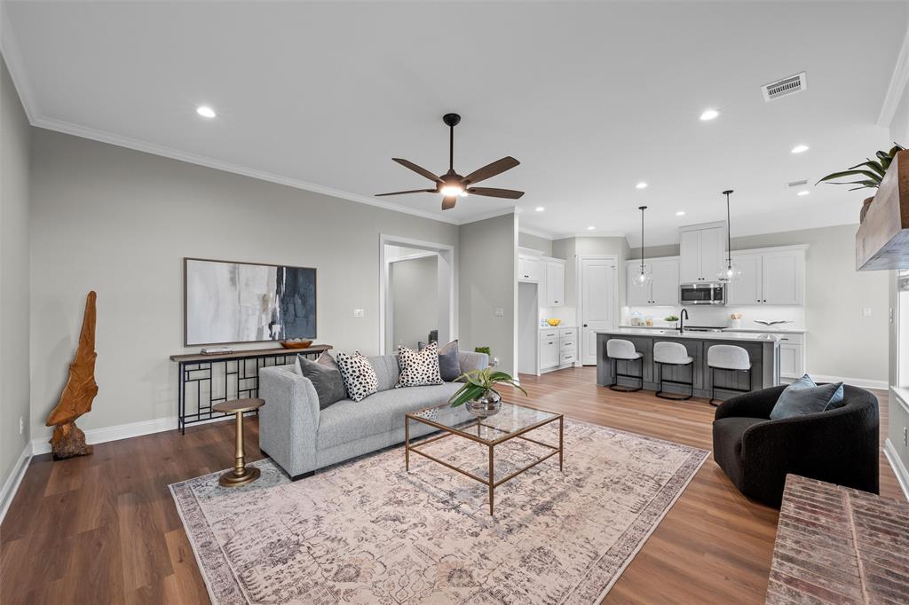 1320 Promised Land Road Hewitt, TX 76643 - Photo 4 of 26 a living room with furniture and wooden floor