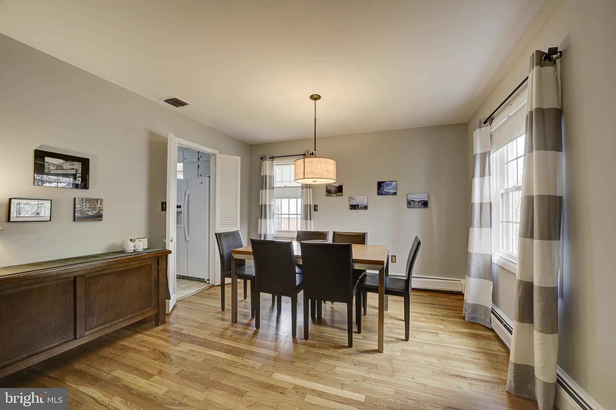 6326 Rockhurst Road Bethesda, MD 20817 - Photo 11 of 32 a view of a dining room with furniture window and wooden floor