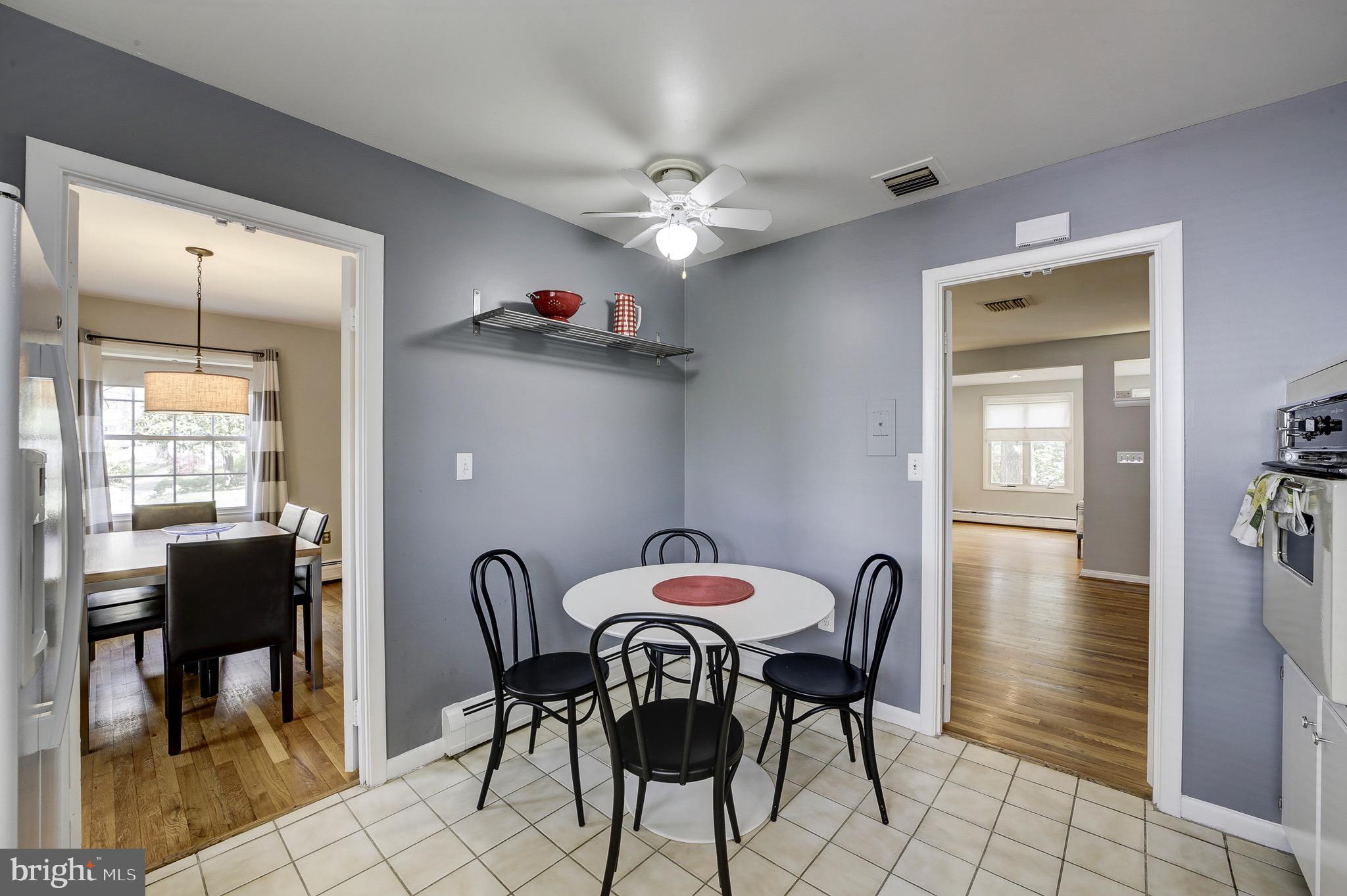 6326 Rockhurst Road Bethesda, MD 20817 - Photo 13 of 32 a view of a dining room with furniture and chandelier