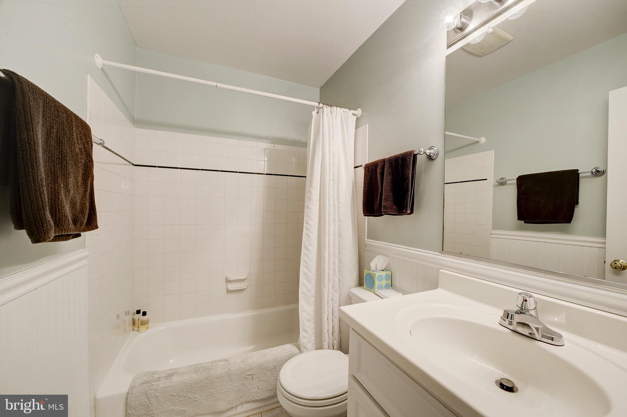 6326 Rockhurst Road Bethesda, MD 20817 - Photo 16 of 32 a bathroom with a sink toilet and shower