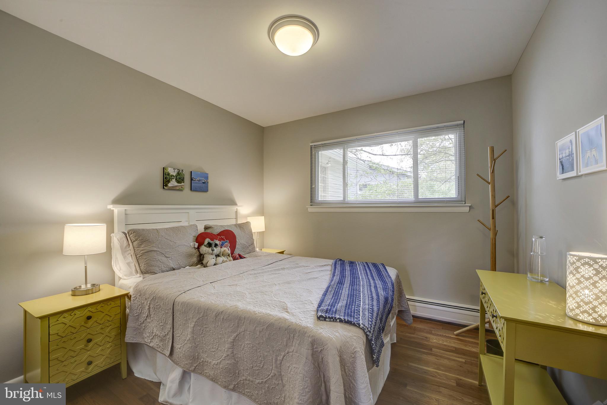6326 Rockhurst Road Bethesda, MD 20817 - Photo 18 of 32 a bedroom with a bed and window