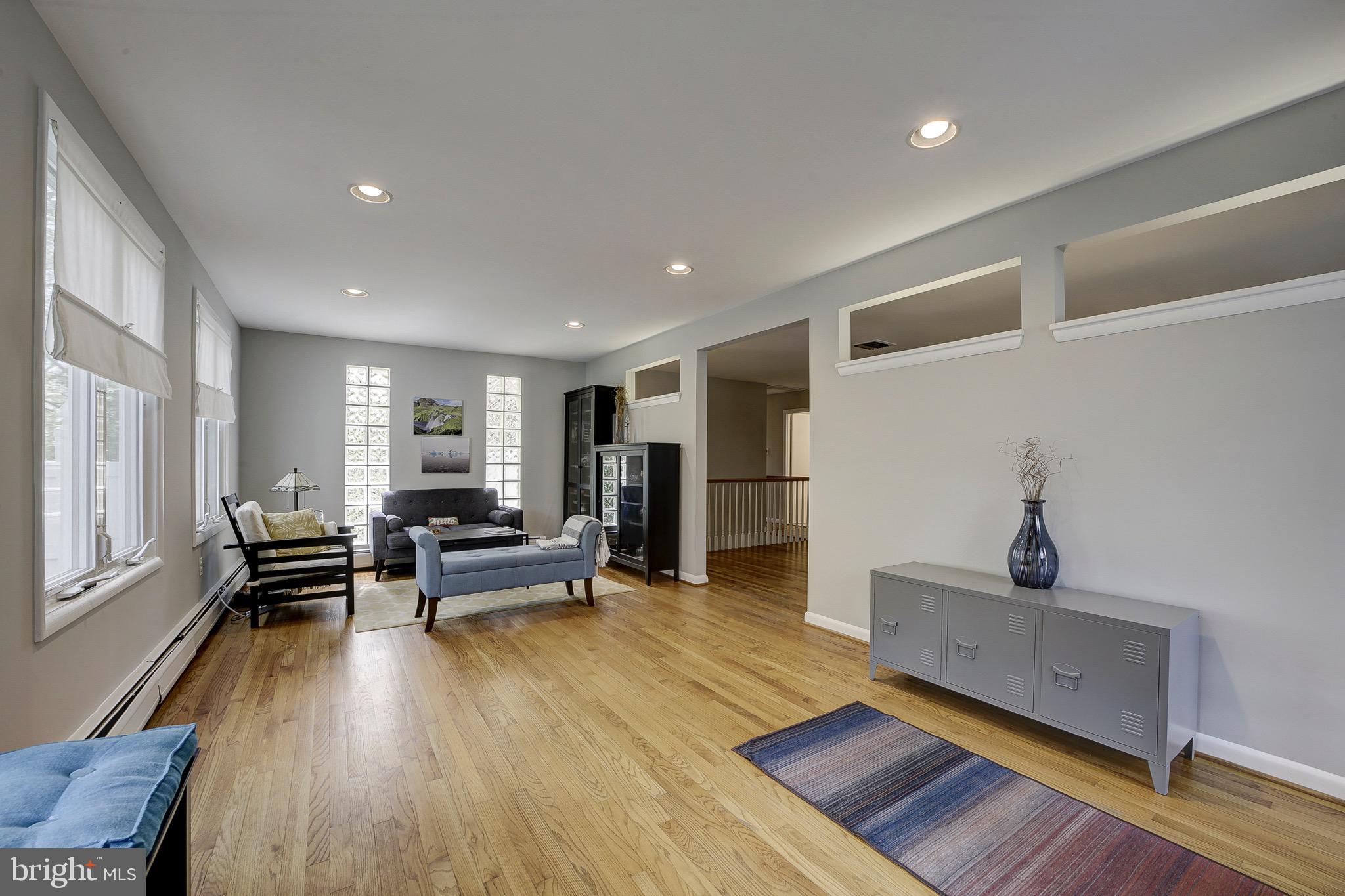 6326 Rockhurst Road Bethesda, MD 20817 - Photo 2 of 32 a living room with furniture and a wooden floor