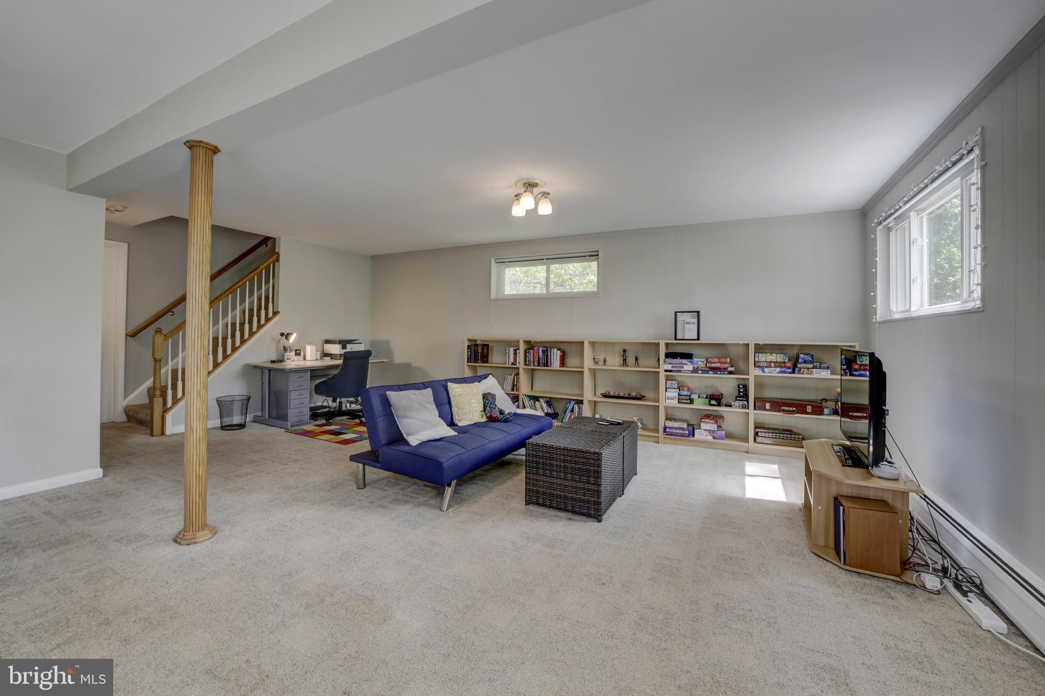 6326 Rockhurst Road Bethesda, MD 20817 - Photo 22 of 32 a living room with furniture and a gym
