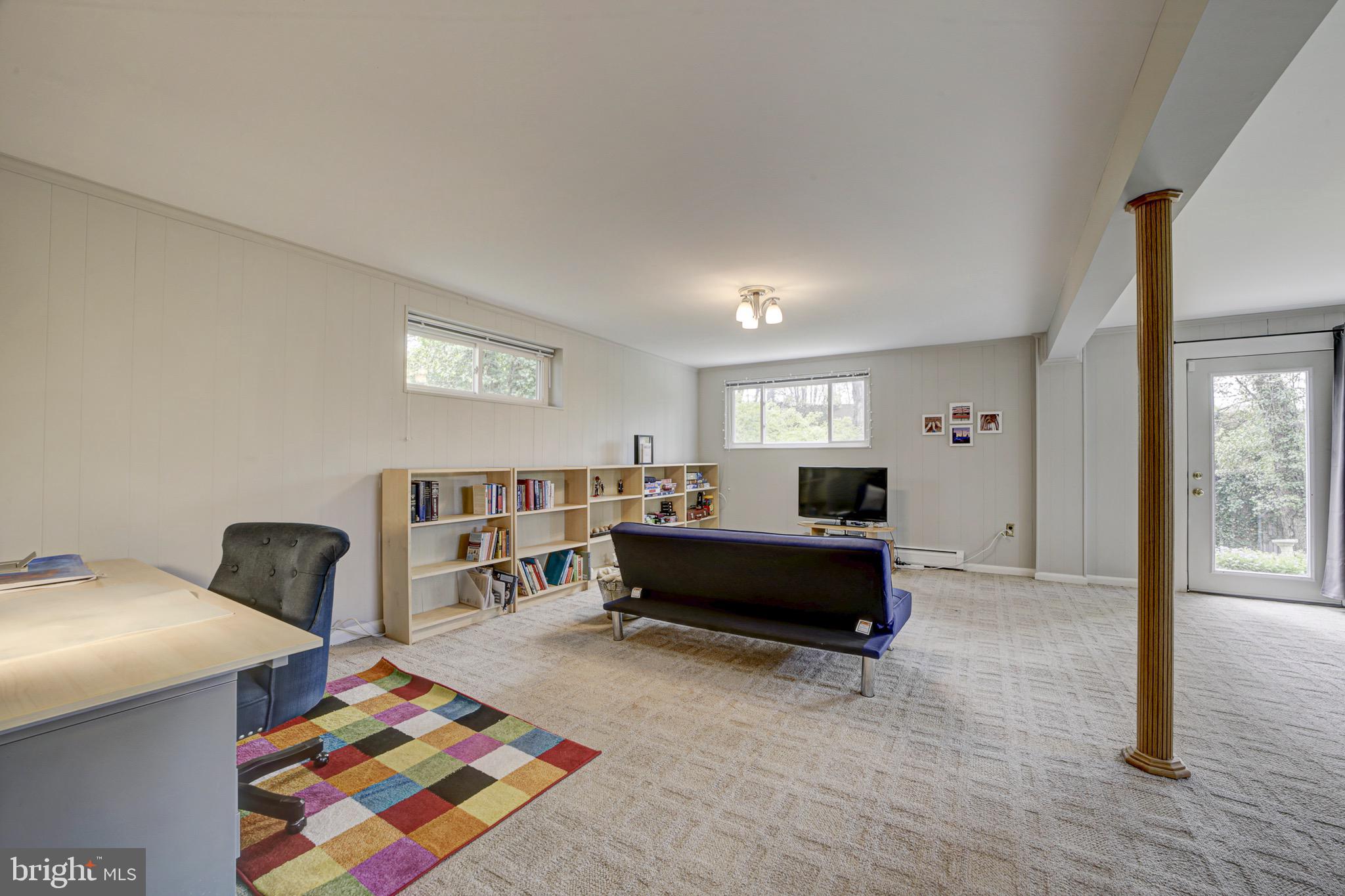 6326 Rockhurst Road Bethesda, MD 20817 - Photo 24 of 32 a living room with furniture and a rug