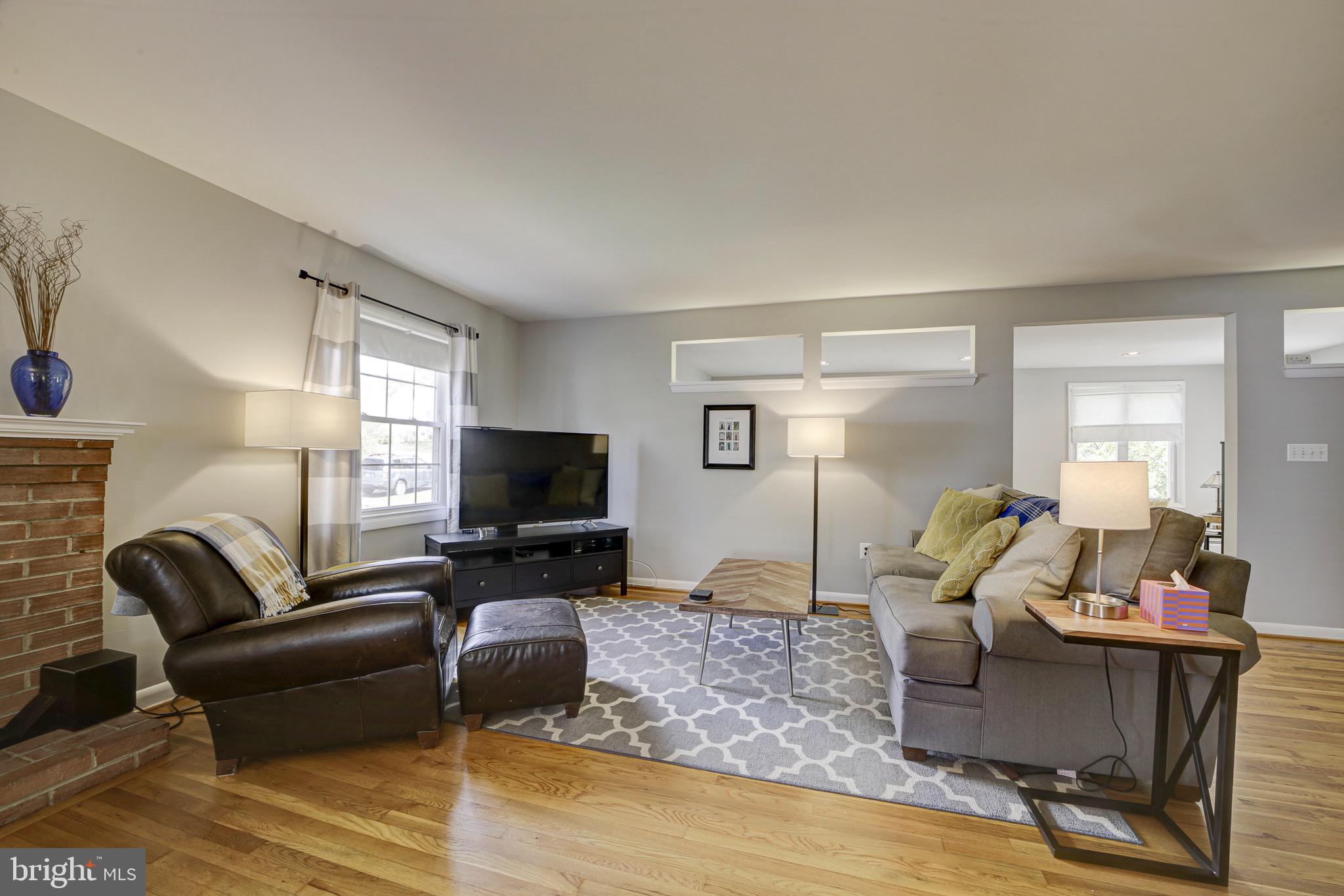 6326 Rockhurst Road Bethesda, MD 20817 - Photo 8 of 32 a living room with furniture and a flat screen tv