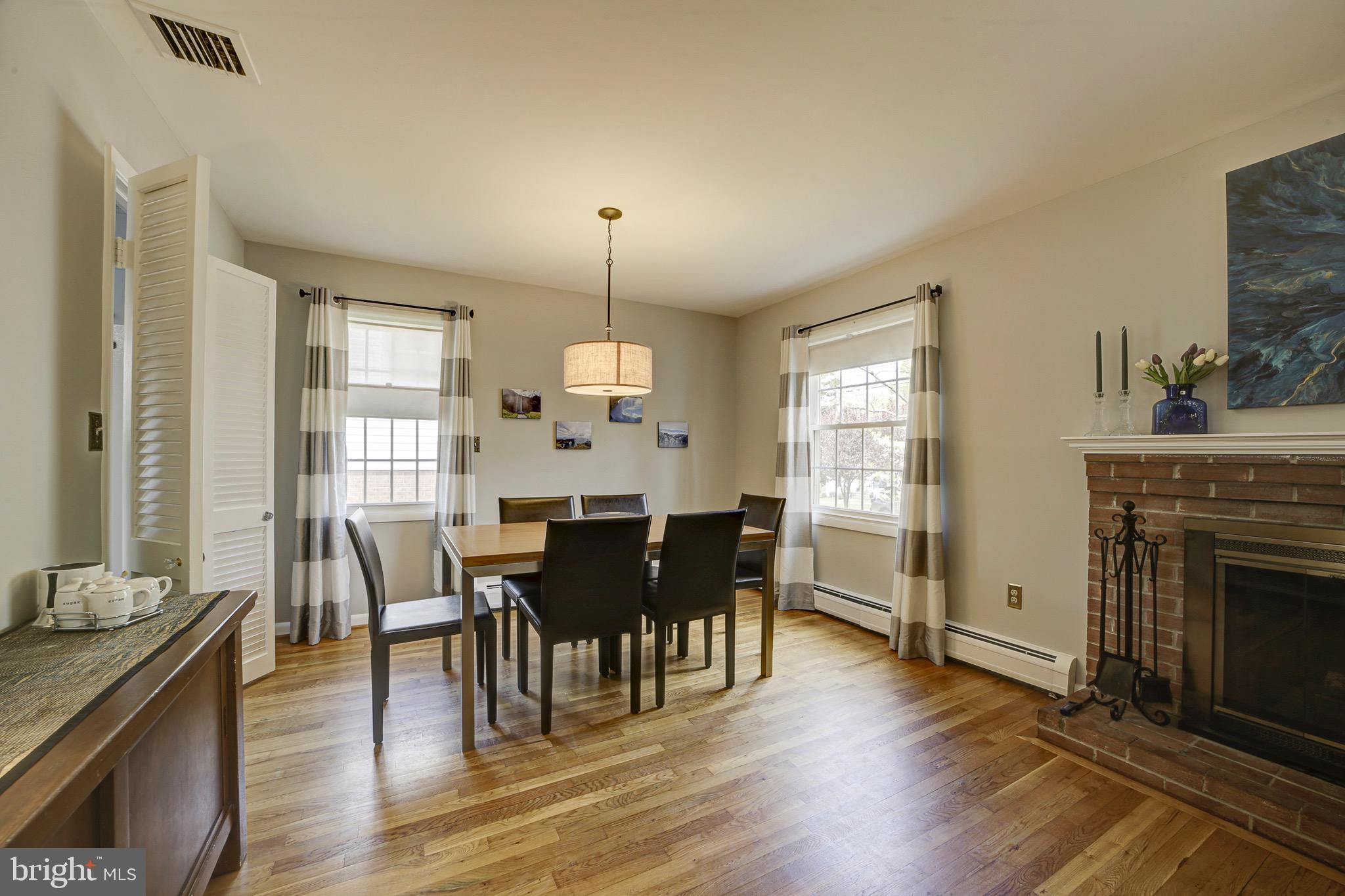 6326 Rockhurst Road Bethesda, MD 20817 - Photo 10 of 32 a view of a dining room with furniture window and wooden floor