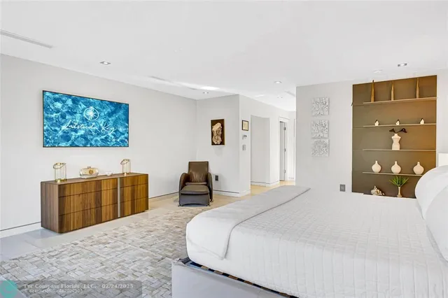 a bedroom with a bed and dresser