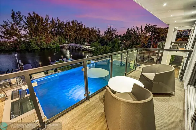 a view of a balcony with chairs