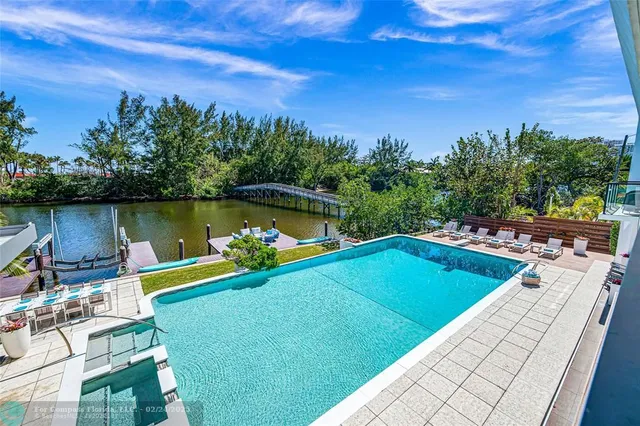 a view of a swimming pool with a patio
