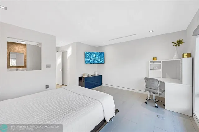 a bedroom with a bed and a chair