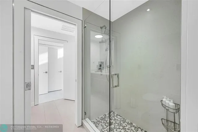 a bathroom with a shower and a toilet