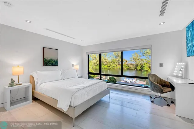 a bedroom with a bed and a night stand