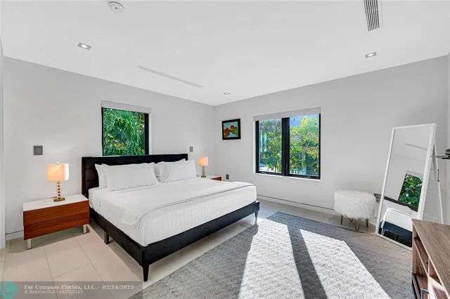 a bed room with a bed and a couch