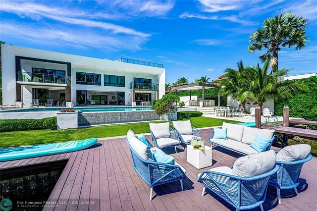 a view of swimming pool with outdoor seating and yard