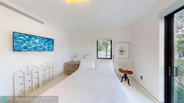 a bedroom with furniture and a window