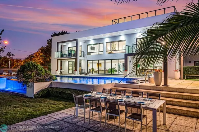 a view of a chairs and table in the patio
