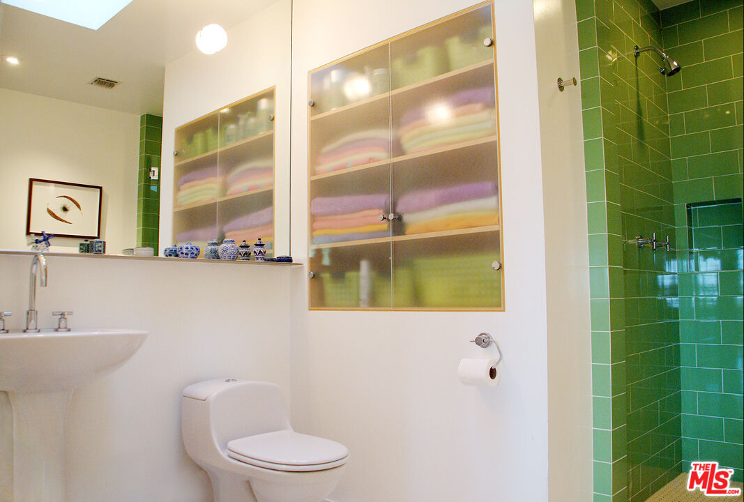 357 North Skyewiay Road Los Angeles, CA 90049 - Photo 13 of 21 a bathroom with a toilet a sink and shower