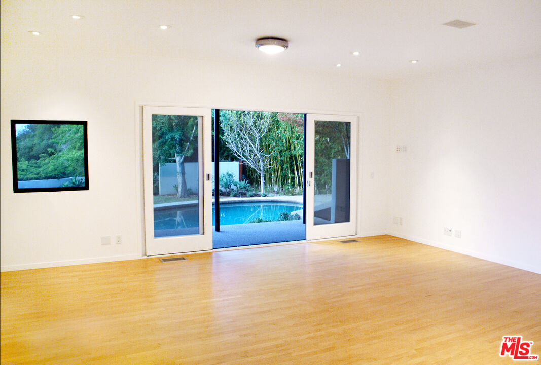 357 North Skyewiay Road Los Angeles, CA 90049 - Photo 16 of 21 a view of an empty room with a window