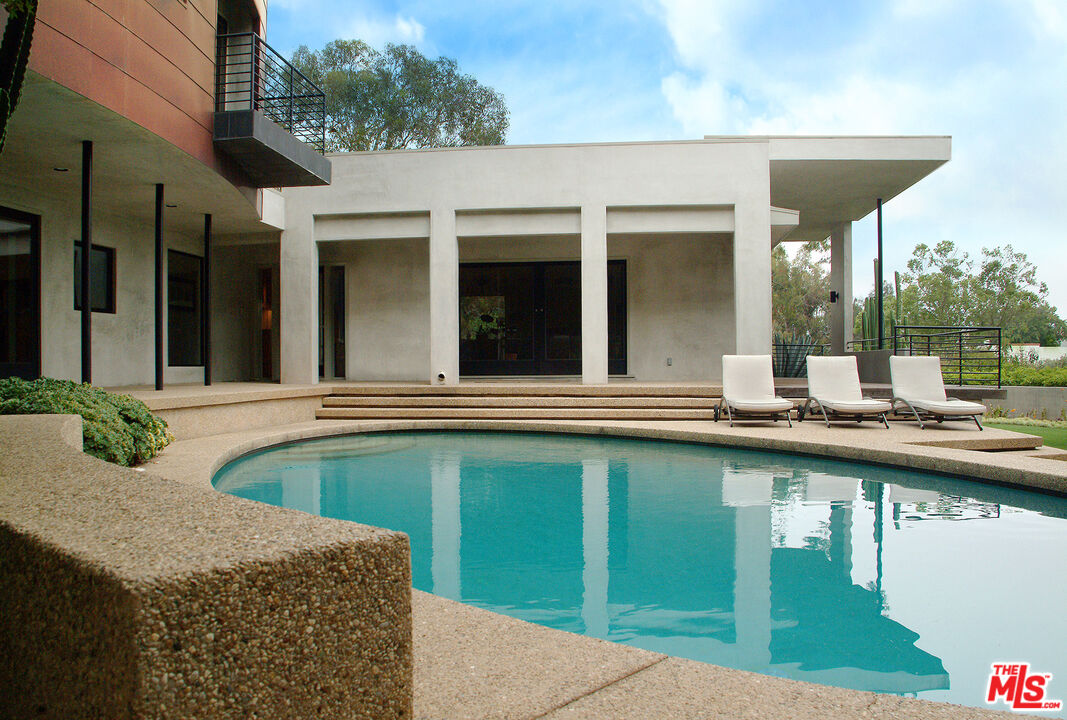 357 North Skyewiay Road Los Angeles, CA 90049 - Photo 2 of 21 a view of a house with pool