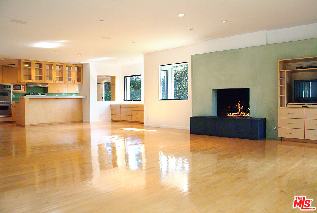 357 North Skyewiay Road Los Angeles, CA 90049 - Photo 10 of 21 a living room with furniture and a flat screen tv