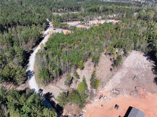 a view of a lake with large trees