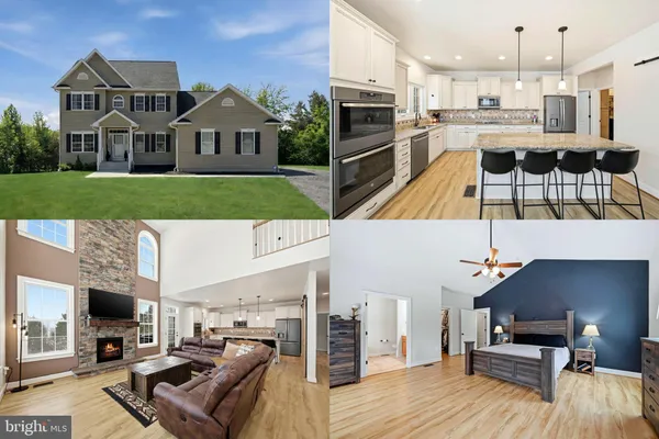 a view of a living room and kitchen with furniture wooden floor and a fireplace