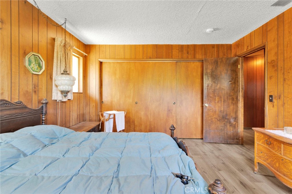 5500 Oil Well Road Phelan, CA 92371 - Photo 22 of 65 a bedroom with a large bed and a window
