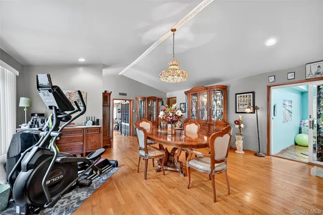 a view of a room with lots of gym equipment