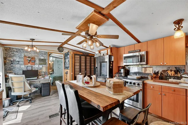 a dining room with a table and chairs