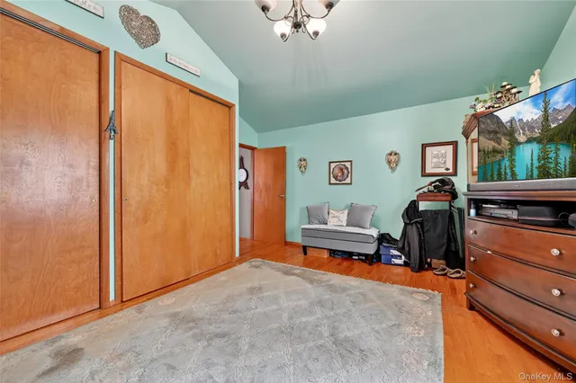 a bedroom with furniture and a window