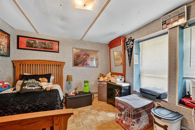 a bedroom with furniture and a window