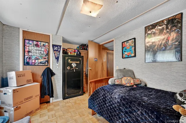 a bedroom with a bed and cabinets