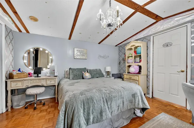 a bedroom with a bed and a desk