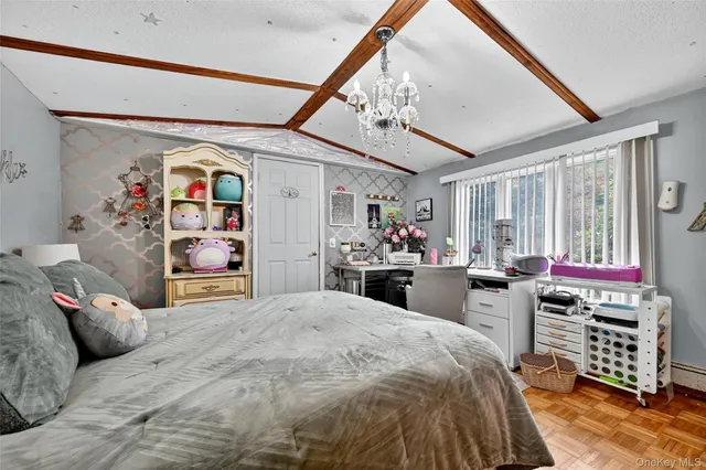 a bed room with a bed and a chair