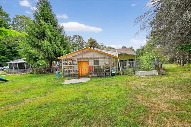 a view of a house with a big yard