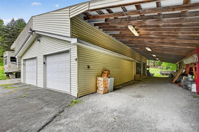 a view of a house with car parked