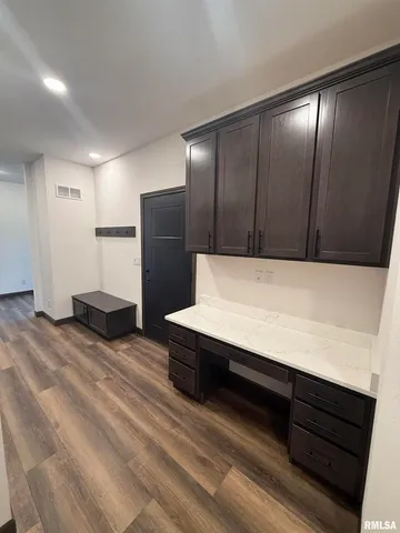 a view of kitchen with stainless steel appliances kitchen island