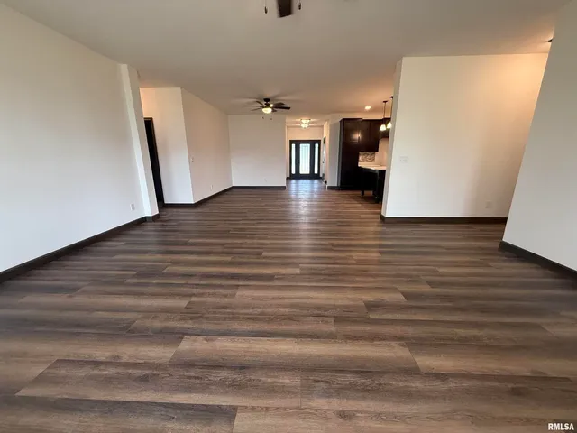 a view of a hallway view with wooden floor