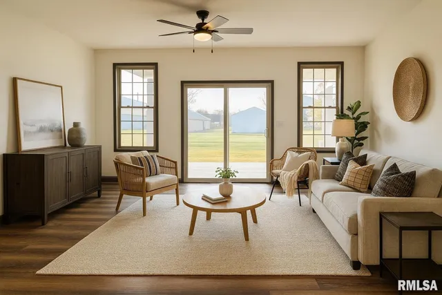 a living room with furniture a window and a chandelier