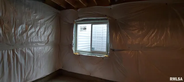 a bathroom with a granite countertop shower and a sink