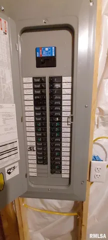 a view of an empty room with wooden roof