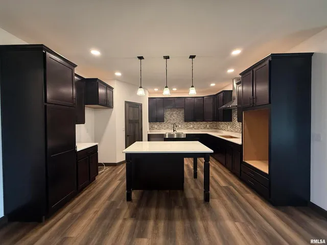 a kitchen with a refrigerator and countertop