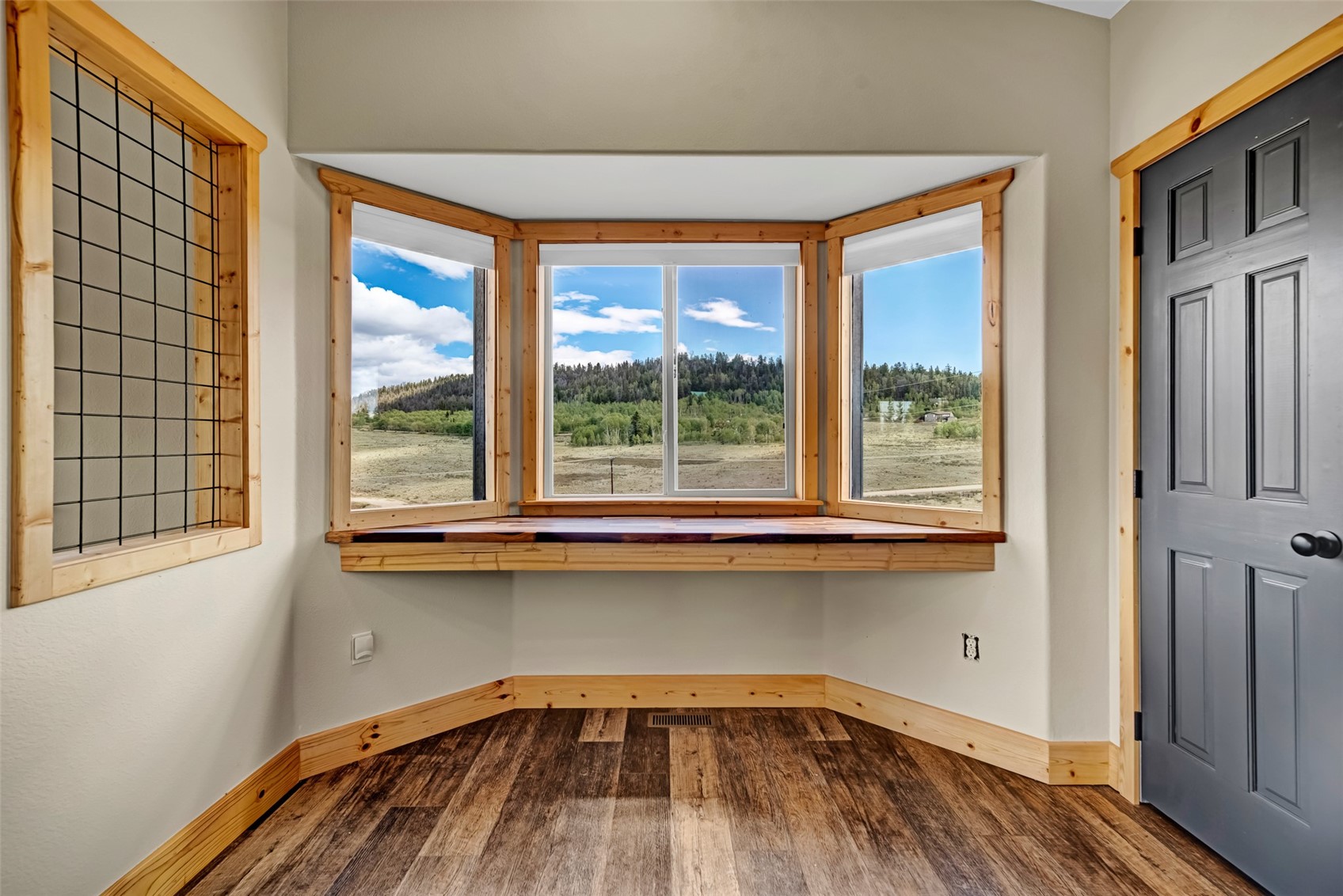 2491 Stagestop Road Jefferson, CO 80456 - Photo 12 of 43 a view of a kitchen with wooden floor and a window